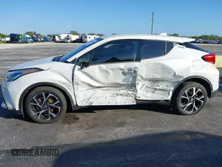 2021 Toyota C-HR LE with VIN NMTKHMBX0MR123981, listed as a IAAI auction lot 41273382 with 51,988 mi miles. Bid and sale history available at carsss.com. Image 6.