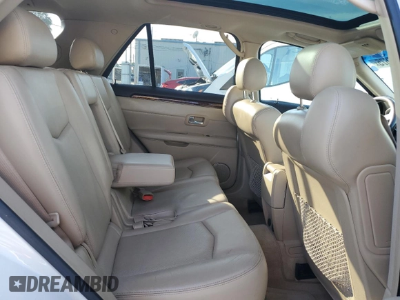 2009 Cadillac SRX RWD z VIN 1GYEE637590113453, wystawiony jako Copart lot #42596675 z przebiegiem 115 118 mil mil oraz Szkoda całkowita • Salvage title. Historia ofert i sprzedaży dostępna na DreamBid. Obrazek 11.