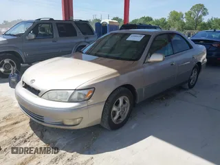 1999 Lexus ES 300 Luxury Sport Sdn with VIN JT8BF28G0X5065317, listed as a IAAI auction lot 42080216 with 163,223 mi miles. Bid and sale history available at carsss.com. Image 2.