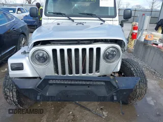 2005 Jeep Wrangler Unlimited with VIN 1J4FA44S25P340852, listed as a IAAI auction lot 41441671 with 139,302 mi miles. Bid and sale history available at carsss.com. Image 6.