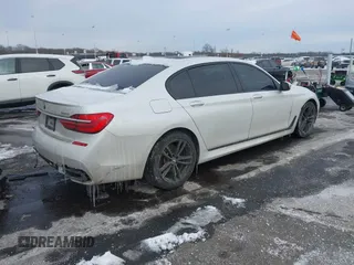 2018 BMW 7 Series 740i xDrive with VIN WBA7E4C59JGV23876, listed as a IAAI auction lot 41381398 with 106,675 mi miles. Bid and sale history available at carsss.com. Image 4.