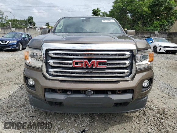 2015 GMC Canyon 4WD SLE with VIN 1GTG6BE38F1263139, listed as a Copart auction lot 75479854 with 124,765 mi miles and Salvage Title. Bid and sale history available at carsss.com. Image 5.