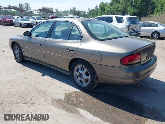 1999 Oldsmobile Intrigue GX z VIN 1G3WH52K5XF334949, wystawiony jako IAAI lot #42252647 z przebiegiem 80 705 mil mil oraz . Historia ofert i sprzedaży dostępna na DreamBid. Obrazek 3.
