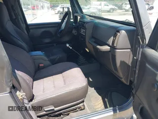 2002 Jeep Wrangler Sport z VIN 1J4FA49S62P731507, wystawiony jako IAAI lot #42584222 z przebiegiem 206 661 mil mil oraz . Historia ofert i sprzedaży dostępna na DreamBid. Obrazek 5.