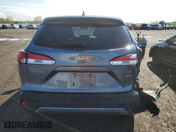 2022 Toyota Corolla Cross LE with VIN 7MUCAABGXNV025847, listed as a Copart auction lot 49153095 with 37,789 mi miles and Salvage title. Bid and sale history available at DreamBid. Image 6.