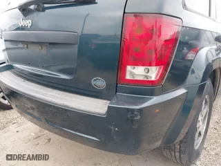 2005 Jeep Grand Cherokee Laredo with VIN 1J4GS48K45C677011, listed as a IAAI auction lot 41121018 with 210,814 mi miles. Bid and sale history available at carsss.com. Image 18.