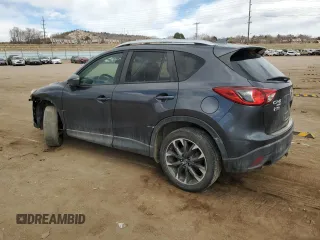 2016 Mazda CX-5 Grand Touring z VIN JM3KE4DY0G0633861, wystawiony jako Copart lot #47748645 z przebiegiem 112 219 mil mil oraz Szkoda całkowita • Salvage title. Historia ofert i sprzedaży dostępna na DreamBid. Obrazek 2.
