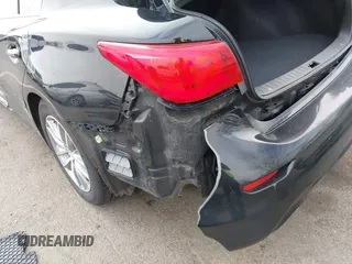 2015 Infiniti Q50 z VIN JN1BV7AR6FM412573, wystawiony jako IAAI lot #41796802 z przebiegiem 136 410 mil mil oraz . Historia ofert i sprzedaży dostępna na DreamBid. Obrazek 6.