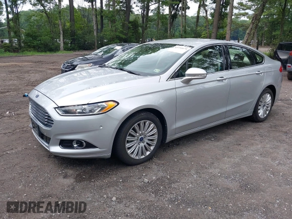 2013 Ford Fusion SE Hybrid z VIN 3FA6P0LU1DR291060, wystawiony jako IAAI lot #42731674 z przebiegiem 93 918 mil mil oraz . Historia ofert i sprzedaży dostępna na DreamBid. Obrazek 2.