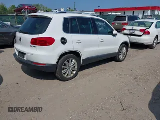 2012 Volkswagen Tiguan SEL with VIN WVGAV7AX5CW517186, listed as a IAAI auction lot 42177269 with 142,285 mi miles and . Bid and sale history available at DreamBid. Image 4.