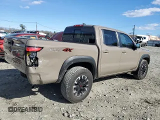 2024 Nissan Frontier Pro-4X with VIN 1N6ED1EK2RN656885, listed as a Copart auction lot 46604165 with 4,390 mi miles and Salvage title. Bid and sale history available at DreamBid. Image 3.