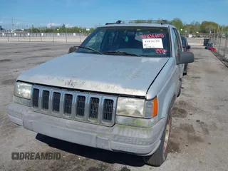 1996 Jeep Grand Cherokee Laredo with VIN 1J4FX58S2TC397006, listed as a IAAI auction lot 41836108 with 136,742 mi miles. Bid and sale history available at carsss.com. Image 6.