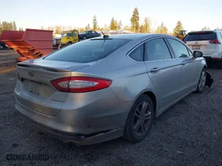 2015 Ford Fusion Energi Titanium with VIN 3FA6P0SU8FR264846, listed as a IAAI auction lot 41552443 with 160,142 mi miles. Bid and sale history available at carsss.com. Image 4.