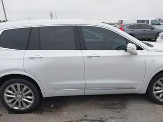 2021 Cadillac XT6 Premium Luxury z VIN 1GYKPCRSXMZ169206, wystawiony jako IAAI lot #41581841 z przebiegiem 64 789 mil mil oraz . Historia ofert i sprzedaży dostępna na DreamBid. Obrazek 13.