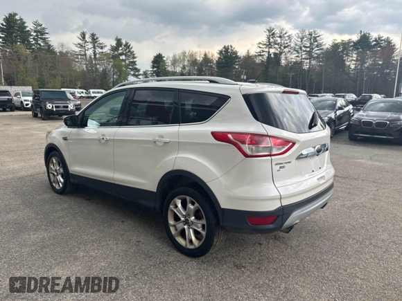 2014 Ford Escape Titanium with VIN 1FMCU9J94EUC63638, listed as a IAAI auction lot 42196241 with 198,112 mi miles and . Bid and sale history available at DreamBid. Image 3.