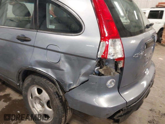 2009 Honda CR-V LX with VIN JHLRE48359C018488, listed as a IAAI auction lot 41824887 with 203,235 mi miles. Bid and sale history available at carsss.com. Image 17.