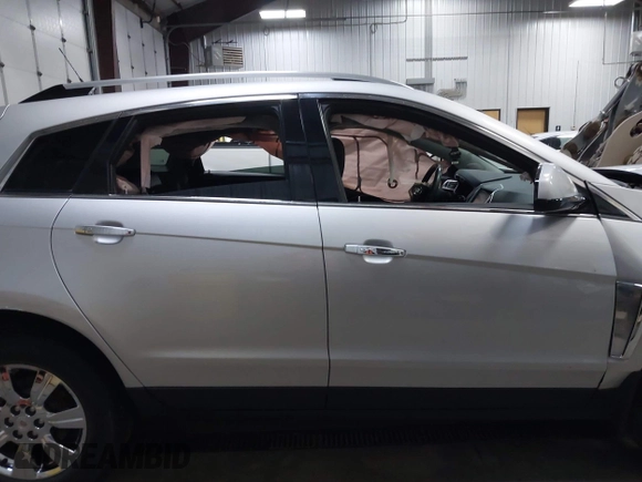 2014 Cadillac SRX Luxury Collection z VIN 3GYFNEE36ES679505, wystawiony jako IAAI lot #41817608 z przebiegiem 62 351 mil mil oraz . Historia ofert i sprzedaży dostępna na DreamBid. Obrazek 13.