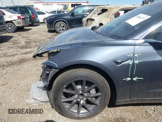 2019 Tesla Model 3 Mid Range with VIN 5YJ3E1EA5KF327679, listed as a IAAI auction lot 41804379 with 87,208 mi miles and . Bid and sale history available at DreamBid. Image 19.
