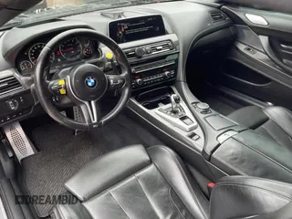 2016 BMW M6 z VIN WBS6G9C54GD932196, wystawiony jako Copart lot #53960063 z przebiegiem 46 162 mil mil oraz . Historia ofert i sprzedaży dostępna na DreamBid. Obrazek 9.