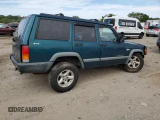 1998 Jeep Cherokee Sport z VIN 1J4FJ68S4WL101110, wystawiony jako Copart lot #57696755 z przebiegiem 218 254 mil mil oraz Szkoda całkowita • Salvage title. Historia ofert i sprzedaży dostępna na DreamBid. Obrazek 3.