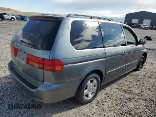 2001 Honda Odyssey EX z VIN 2HKRL18691H571178, wystawiony jako Copart lot #57343205 z przebiegiem 198 506 mil mil oraz Czysty tytuł • Clean title. Historia ofert i sprzedaży dostępna na DreamBid. Obrazek 3.