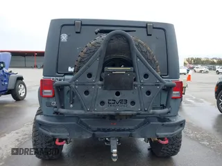 2013 Jeep Wrangler Rubicon 10th Anniversary with VIN 1C4BJWCG2DL651815, listed as a IAAI auction lot 41643919 with 98,297 mi miles and . Bid and sale history available at DreamBid. Image 16.