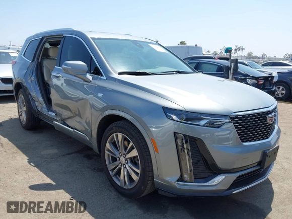 2023 Cadillac XT6 FWD Premium Luxury with VIN 1GYKPCRS6PZ163018, listed as a IAAI auction lot 42437403 with 21,366 mi miles and . Bid and sale history available at DreamBid. Image 1.