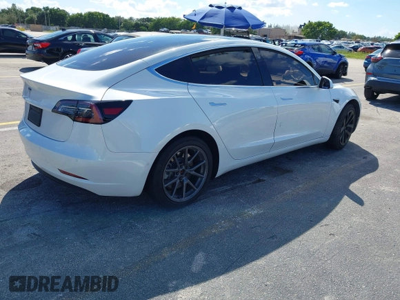 2020 Tesla Model 3 Standard Range Plus with VIN 5YJ3E1EA8LF783631, listed as a IAAI auction lot 40696383 with 78,889 mi miles. Bid and sale history available at carsss.com. Image 4.