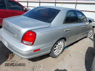 2003 Hyundai XG z VIN KMHFU45E13A261934, wystawiony jako IAAI lot #42121245 z przebiegiem 210 498 mil mil oraz . Historia ofert i sprzedaży dostępna na DreamBid. Obrazek 4.