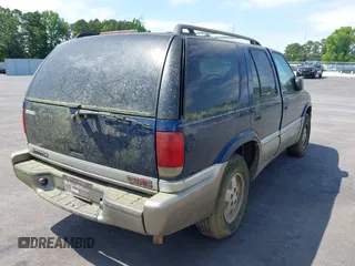 2001 GMC Jimmy SLE z VIN 1GKDT13W612136433, wystawiony jako IAAI lot #42336277 z przebiegiem Nie podano mil oraz . Historia ofert i sprzedaży dostępna na DreamBid. Obrazek 4.