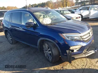2017 Honda Pilot Touring z VIN 5FNYF5H91HB007537, wystawiony jako IAAI lot #41006026 z przebiegiem 78 917 mil mil oraz . Historia ofert i sprzedaży dostępna na DreamBid. Obrazek 1.