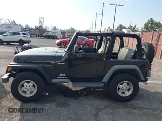 2003 Jeep Wrangler Sport with VIN 1J4FA49S23P328867, listed as a IAAI auction lot 41354414 with 96,703 mi miles. Bid and sale history available at carsss.com. Image 14.
