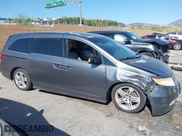 2011 Honda Odyssey Touring with VIN 5FNRL5H96BB009580, listed as a IAAI auction lot 42202595 with Not provided miles and . Bid and sale history available at DreamBid. Image 13.