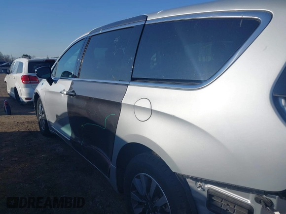 2023 Chrysler Pacifica Hybrid Limited with VIN 2C4RC1S72PR588627, listed as a IAAI auction lot 42063631 with 52,799 mi miles and . Bid and sale history available at DreamBid. Image 18.