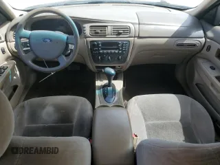 2007 Ford Taurus SE with VIN 1FAFP53U17A151246, listed as a Copart auction lot 60221955 with 284,321 mi miles and Salvage title. Bid and sale history available at DreamBid. Image 8.