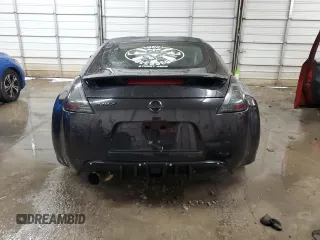 2009 Nissan 370Z z VIN JN1AZ44EX9M407193, wystawiony jako Copart lot #84891734 z przebiegiem 129 296 mil mil oraz Szkoda całkowita • Salvage title. Historia ofert i sprzedaży dostępna na DreamBid. Obrazek 6.