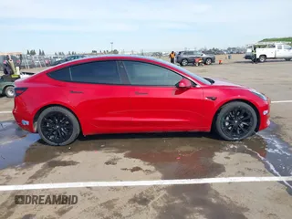 2021 Tesla Model 3 Long Range with VIN 5YJ3E1EB2MF015279, listed as a IAAI auction lot 41765428 with 55,486 mi miles. Bid and sale history available at carsss.com. Image 13.