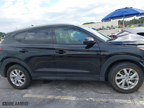 2019 Hyundai Tucson Value with VIN KM8J33A40KU068014, listed as a IAAI auction lot 40877057 with 34,966 mi miles. Bid and sale history available at carsss.com. Image 13.