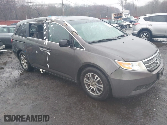 2012 Honda Odyssey EX-L with VIN 5FNRL5H64CB037689, listed as a IAAI auction lot 41857822 with 121,601 mi miles and . Bid and sale history available at carsss.com. Image 1.
