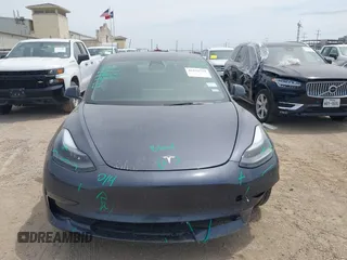 2023 Tesla Model 3 with VIN 5YJ3E1EA5PF565071, listed as a IAAI auction lot 42232719 with 15,389 mi miles and . Bid and sale history available at DreamBid. Image 13.