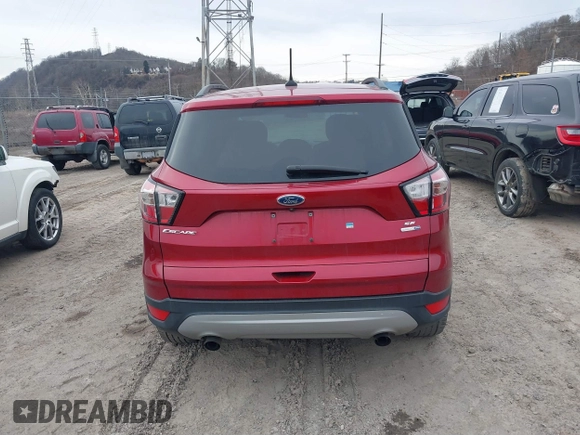 2018 Ford Escape SE z VIN 1FMCU9GD6JUA18684, wystawiony jako IAAI lot #41499540 z przebiegiem 105 127 mil mil oraz . Historia ofert i sprzedaży dostępna na DreamBid. Obrazek 16.