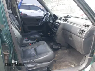 2000 Honda CR-V SE with VIN JHLRD1875YS022873, listed as a IAAI auction lot 42034984 with 210,853 mi miles. Bid and sale history available at carsss.com. Image 5.