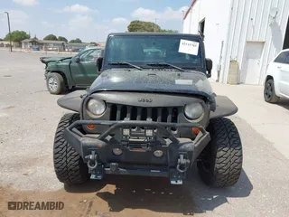 2013 Jeep Wrangler Unlimited Sport with VIN 1C4BJWDG9DL569109, listed as a IAAI auction lot 42115703 with 120,803 mi miles. Bid and sale history available at carsss.com. Image 12.