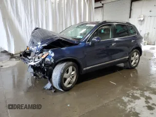 2014 Volkswagen Touareg Sport z VIN WVGEF9BP2ED002718, wystawiony jako Copart lot #59526575 z przebiegiem 194 480 mil mil oraz Nie do naprawy • Non repairable. Historia ofert i sprzedaży dostępna na DreamBid. Obrazek 1.