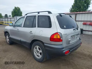 2003 Hyundai Santa Fe GLS z VIN KM8SC73DX3U357525, wystawiony jako IAAI lot #42436777 z przebiegiem 228 844 mil mil oraz . Historia ofert i sprzedaży dostępna na DreamBid. Obrazek 3.