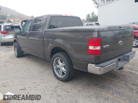 2005 Ford F-150 XLT with VIN 1FTRW12W15KE64553, listed as a IAAI auction lot 42009373 with 106,454 mi miles. Bid and sale history available at carsss.com. Image 3.