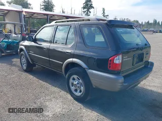 2001 Isuzu Rodeo S z VIN 4S2CK58W914361058, wystawiony jako IAAI lot #42404904 z przebiegiem 125 945 mil mil oraz . Historia ofert i sprzedaży dostępna na DreamBid. Obrazek 3.