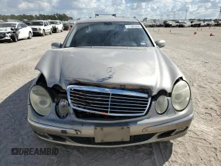 2003 Mercedes-Benz E-Class 5.0L with VIN WDBUF70J73A119596, listed as a Copart auction lot 77382424 with 237,620 mi miles and Salvage Title. Bid and sale history available at carsss.com. Image 5.