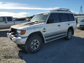1999 Mitsubishi Montero z VIN JA4MR51R9XJ007139, wystawiony jako Copart lot #41682545 z przebiegiem 200 002 mil mil oraz Tytuł czysty. Historia ofert i sprzedaży dostępna na DreamBid. Obrazek 1.