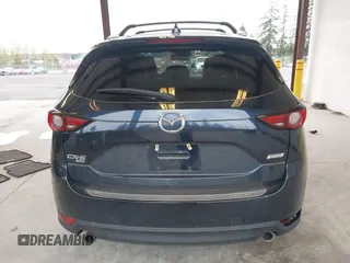 2018 Mazda CX-5 Grand Touring with VIN JM3KFBDM4J0302870, listed as a IAAI auction lot 41934217 with 57,151 mi miles. Bid and sale history available at carsss.com. Image 17.